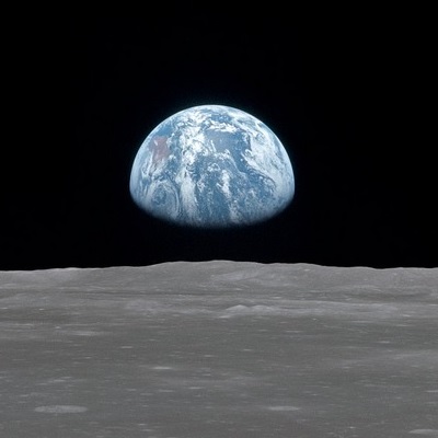 Earth rising over the moon